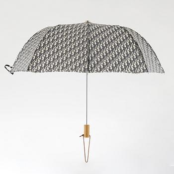 Christian Dior, a canvas weekend bag and umbrella.