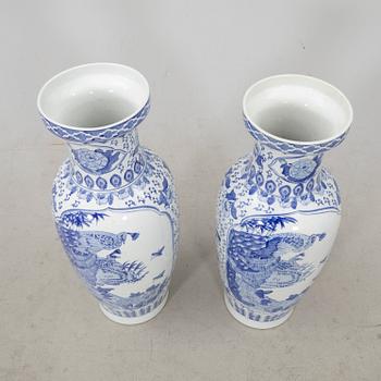 A pair of porcelain 21st century floor vases.