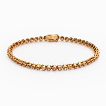 Armband, 18K guld och briljantslipade diamanter.