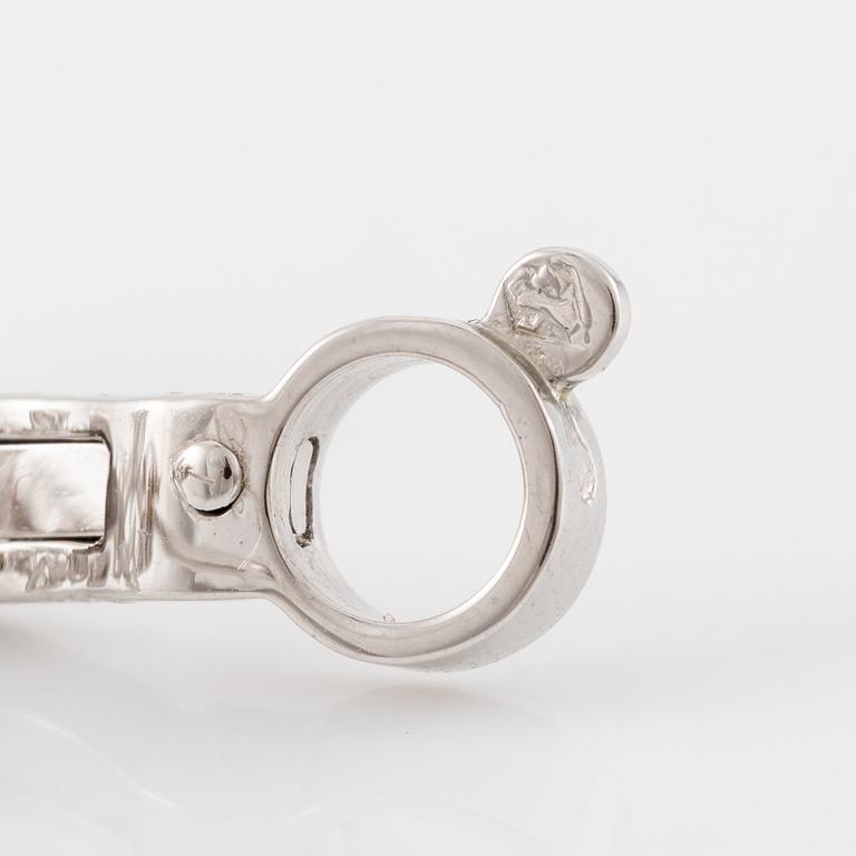 Cartier a pair of earrings platinum set with drop-shaped and round brilliant-cut diamonds.