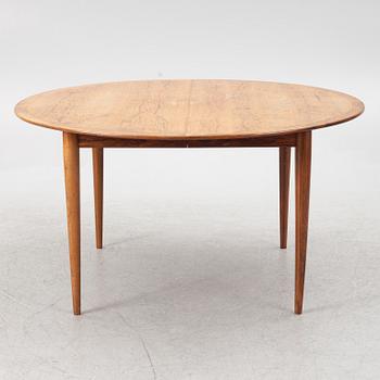 Niels Otto Møller, a rosewood dining table and eight rosewood chairs, Poul Jeppesen & JL Möller, Denmark, 1960's.