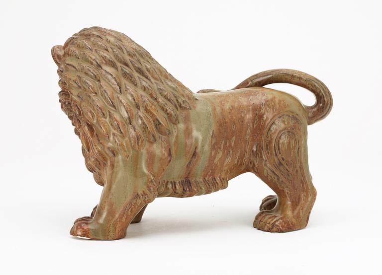 A Gunnar Nylund stoneware figure of a lion, Rörstrand.