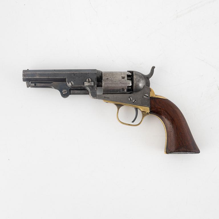 A Colt 1849 Pocket Revolver.