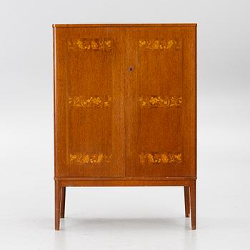 A Swedish Modern cabinet, 1940s.
