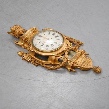 A gustavian style wall clock, signed Rob. Engström, Stockholm. First half of the 20th century.