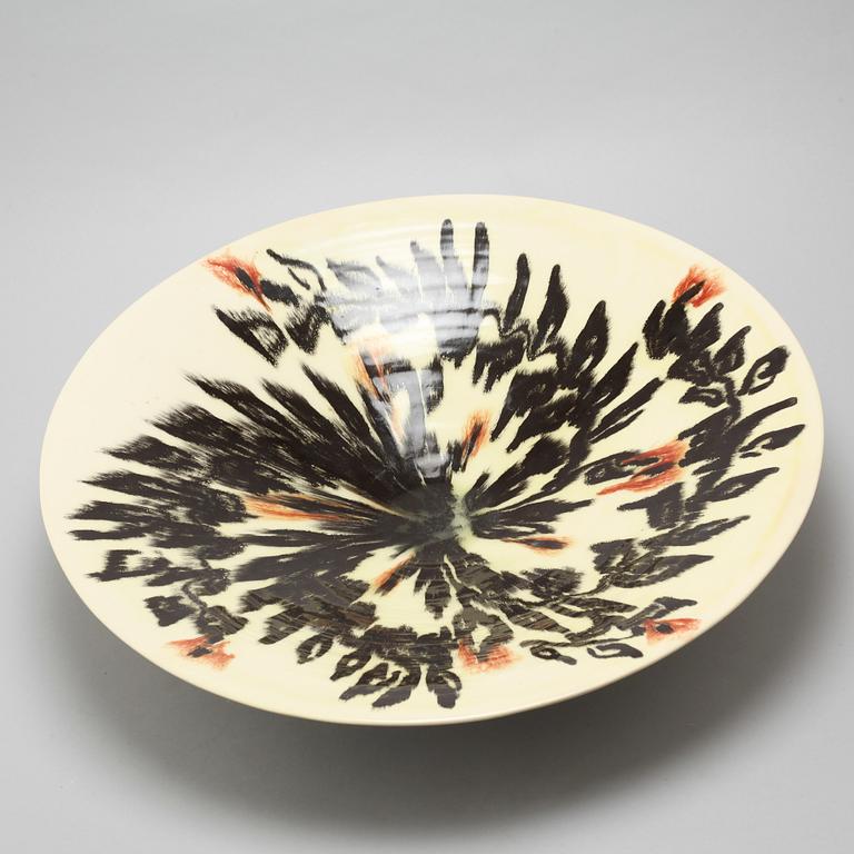 JEAN BESNARD, a glazed ceramic charger, France, signed and dated 1925.