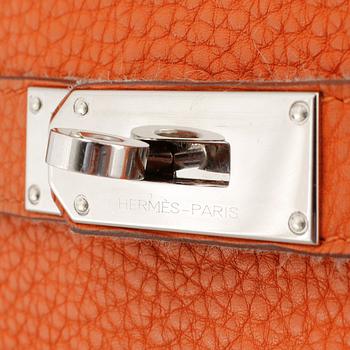 HERMÈS, an orange Clemence bullcalf "Jypsière" shoulder bag.