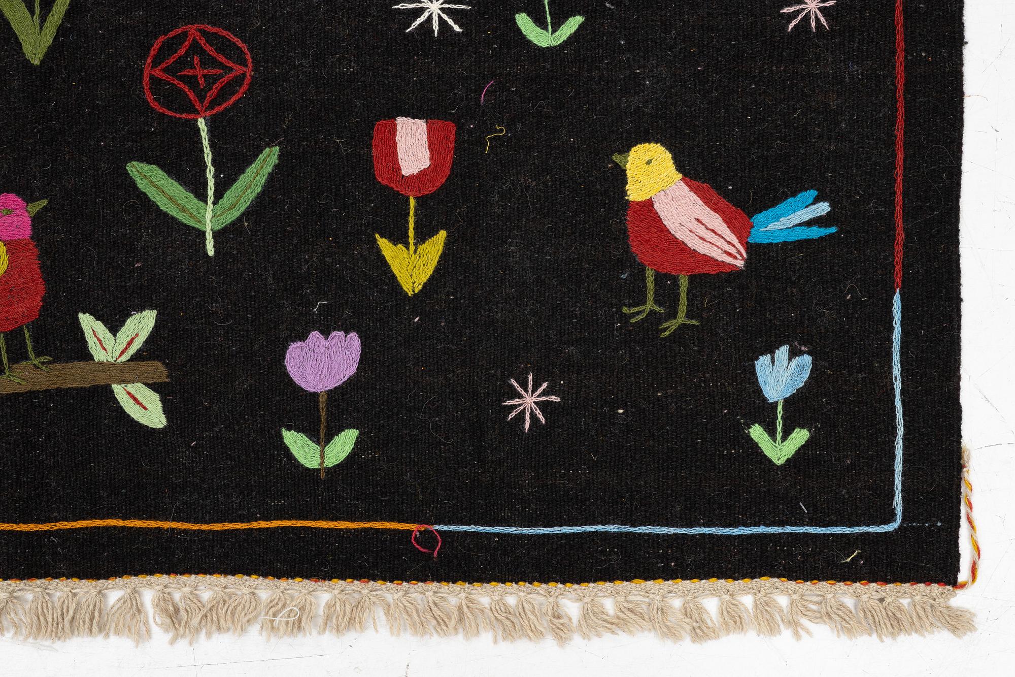 A hand-embroidered Kelim rug, 204 x 150 cm.