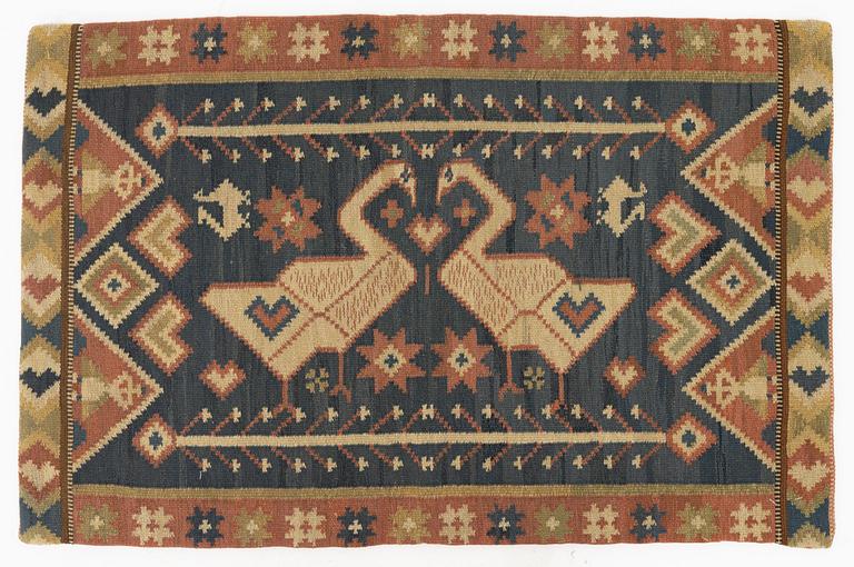 A carriage cushion, flat weave, c 87 x 58 cm, Skåne, circa 1900.