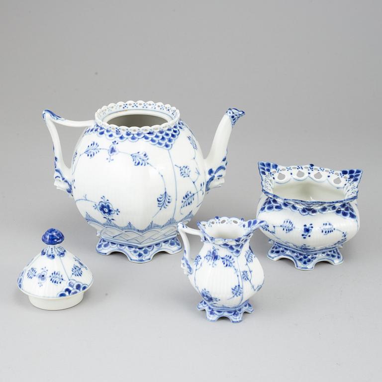 ROYAL COPENHAGEN, a 'Musselmalet Full Lace' porcelain teapot, creamer and sugarbowl, Denmark.