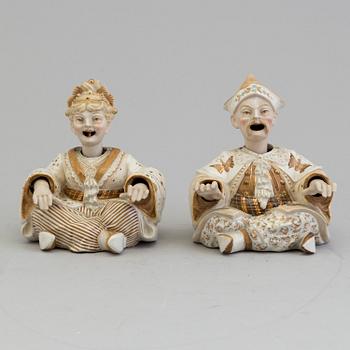 A pair of Chinese style 20th century porcelain nodding figures.