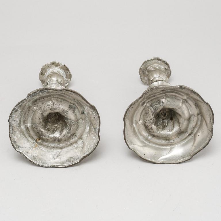 A pair of Rococo candlesticks in pewter, made by Eric Pettersson Krietz in Stockholm 1763.