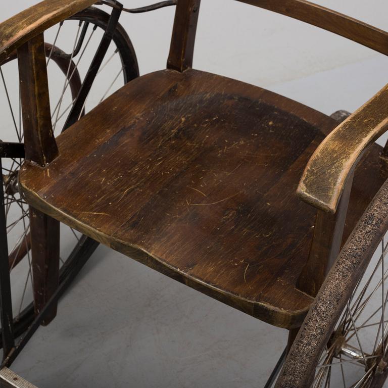 An early 20th century wheel chair.