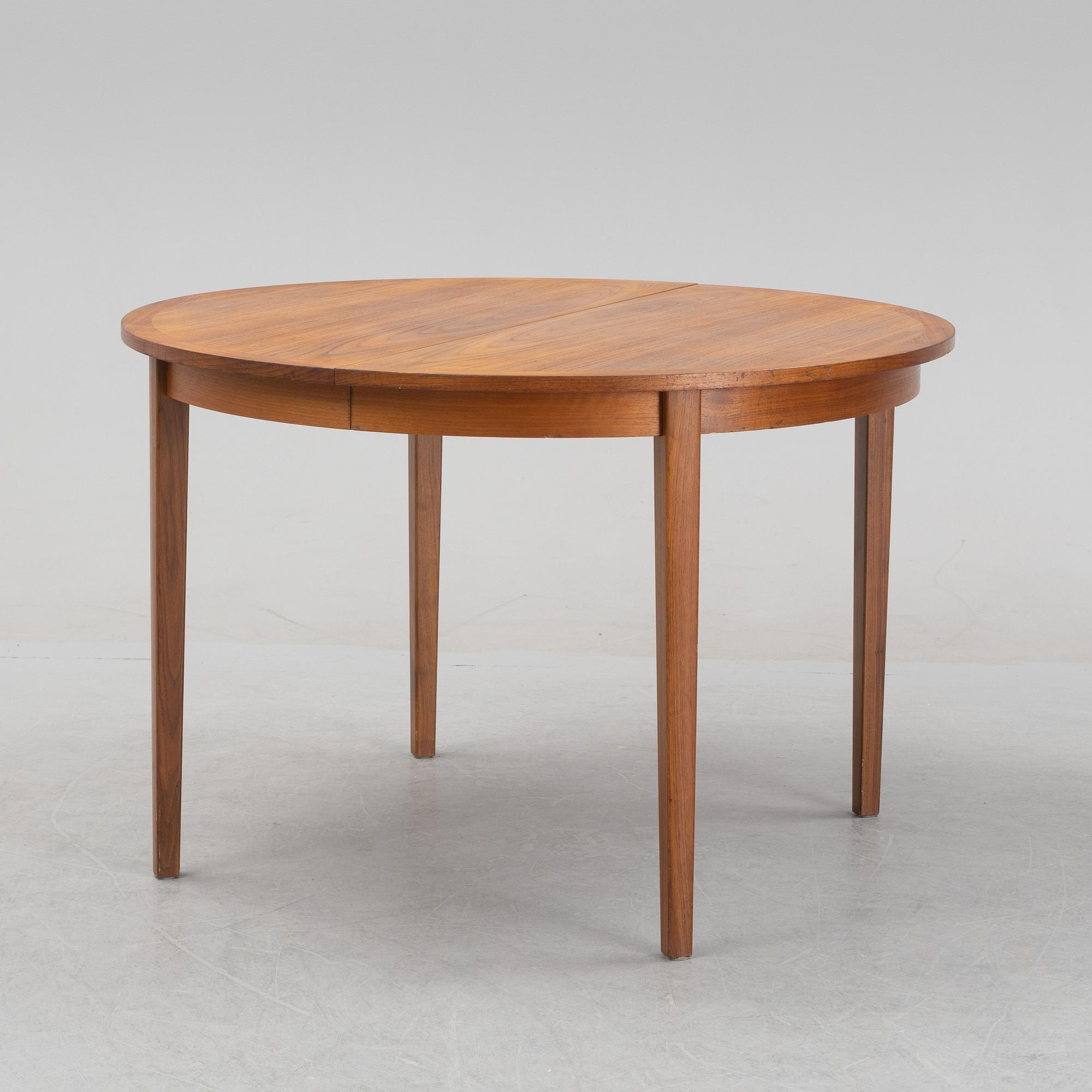 A teak veneered dining table, 1960's.