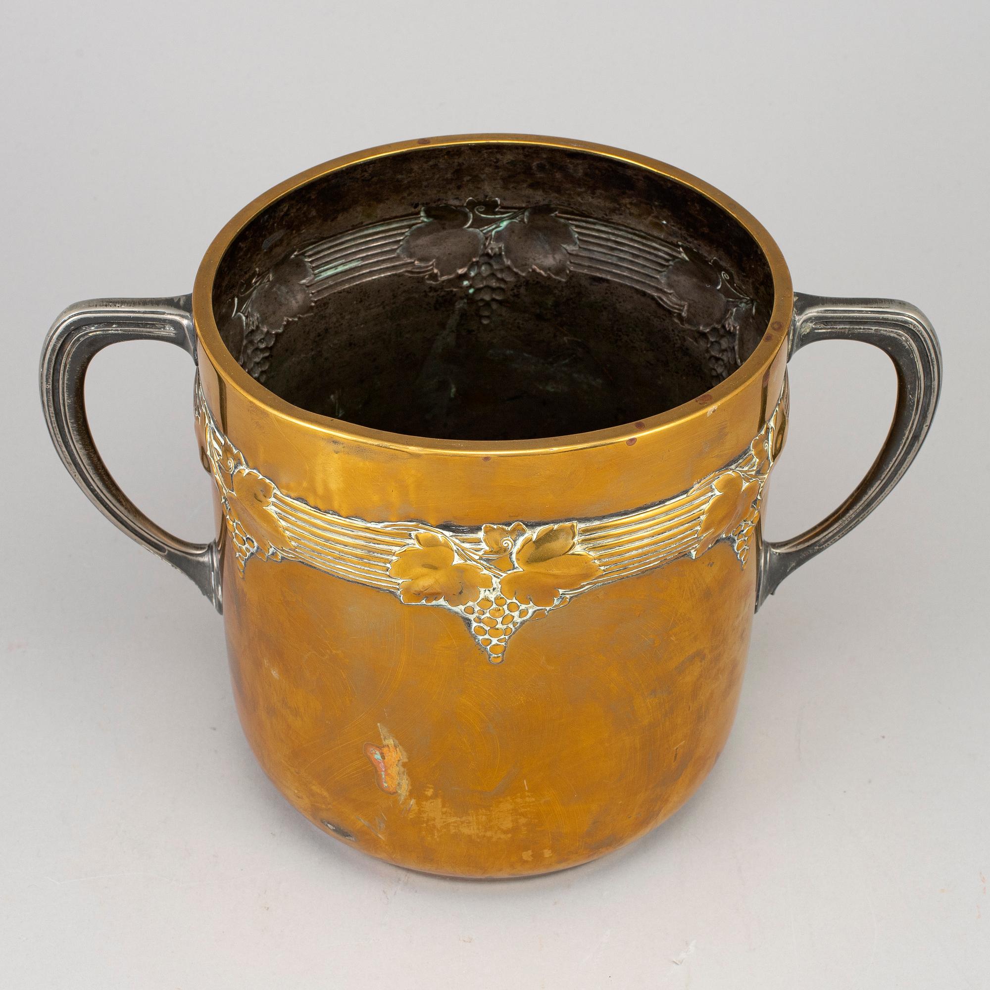 An art nouveau brass champagne cooler, early 20th century.