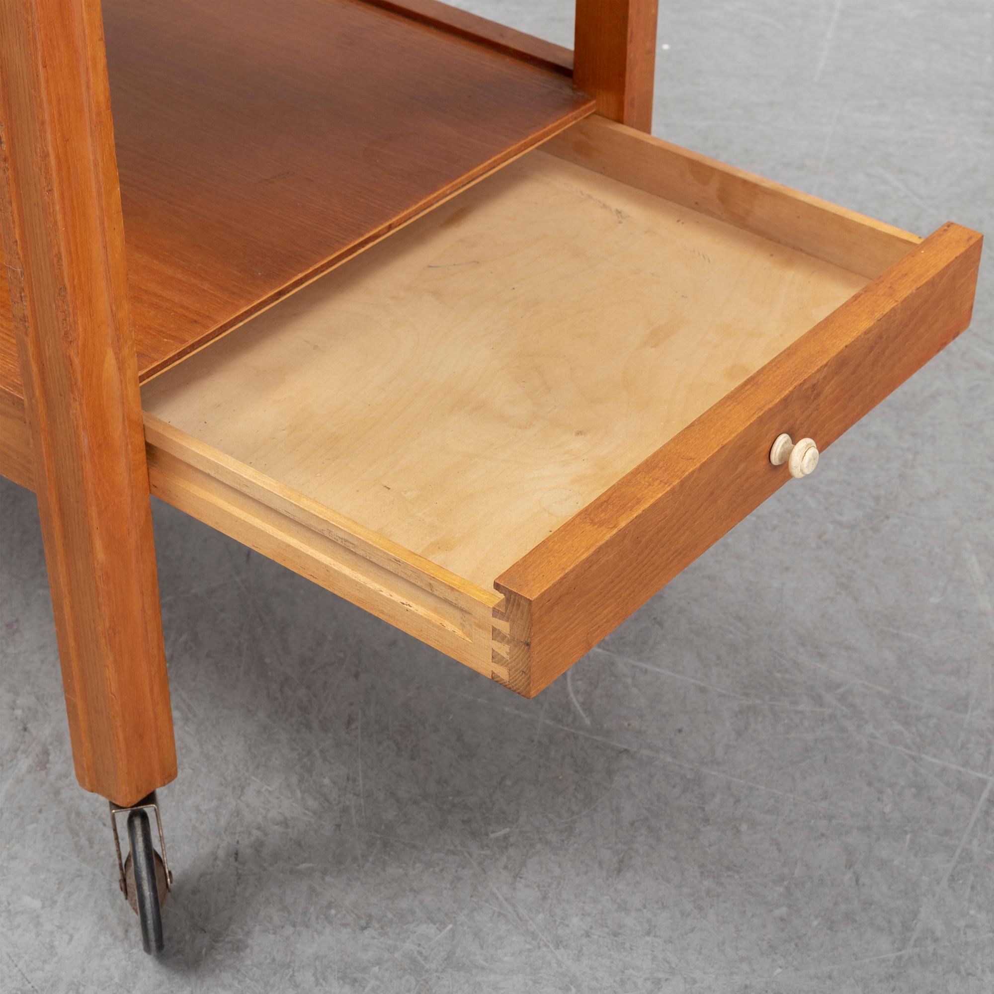 A 1930s/1940s elm veneered trolley.