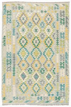 A Kilim rug, c. 245 x 162 cm.