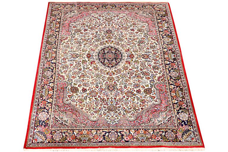 A Quum rug, c. 204 x 134 cm.