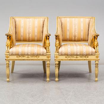 A pair of late Gustavian style armchairs, circa 1900.