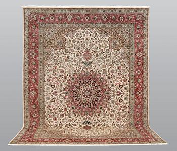 A carpet, Tabriz part silk, so called 50 Raj, cm 400 x 300 cm.