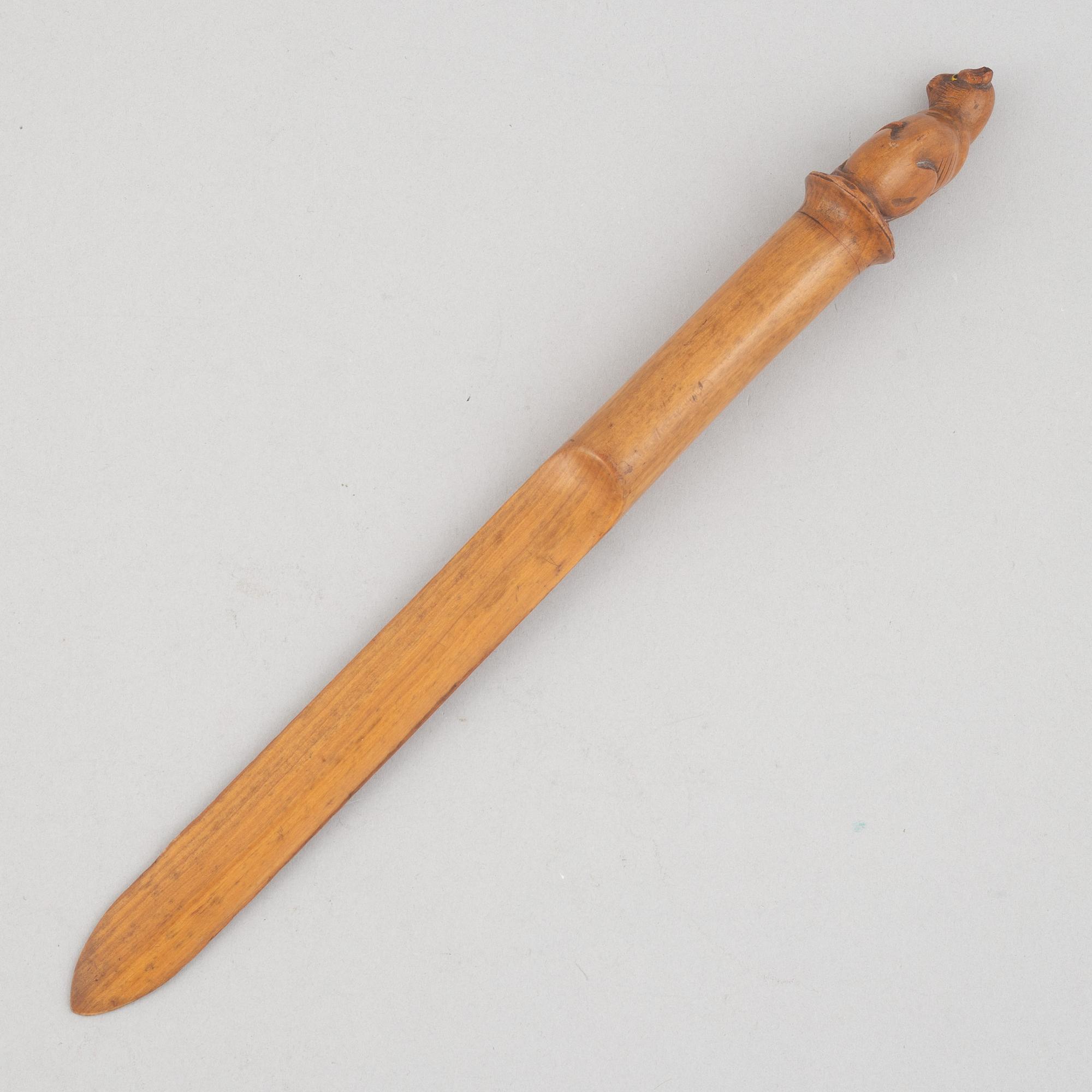 A carved wooden letter opener in the manner of Sophia Isberg, 19th century.
