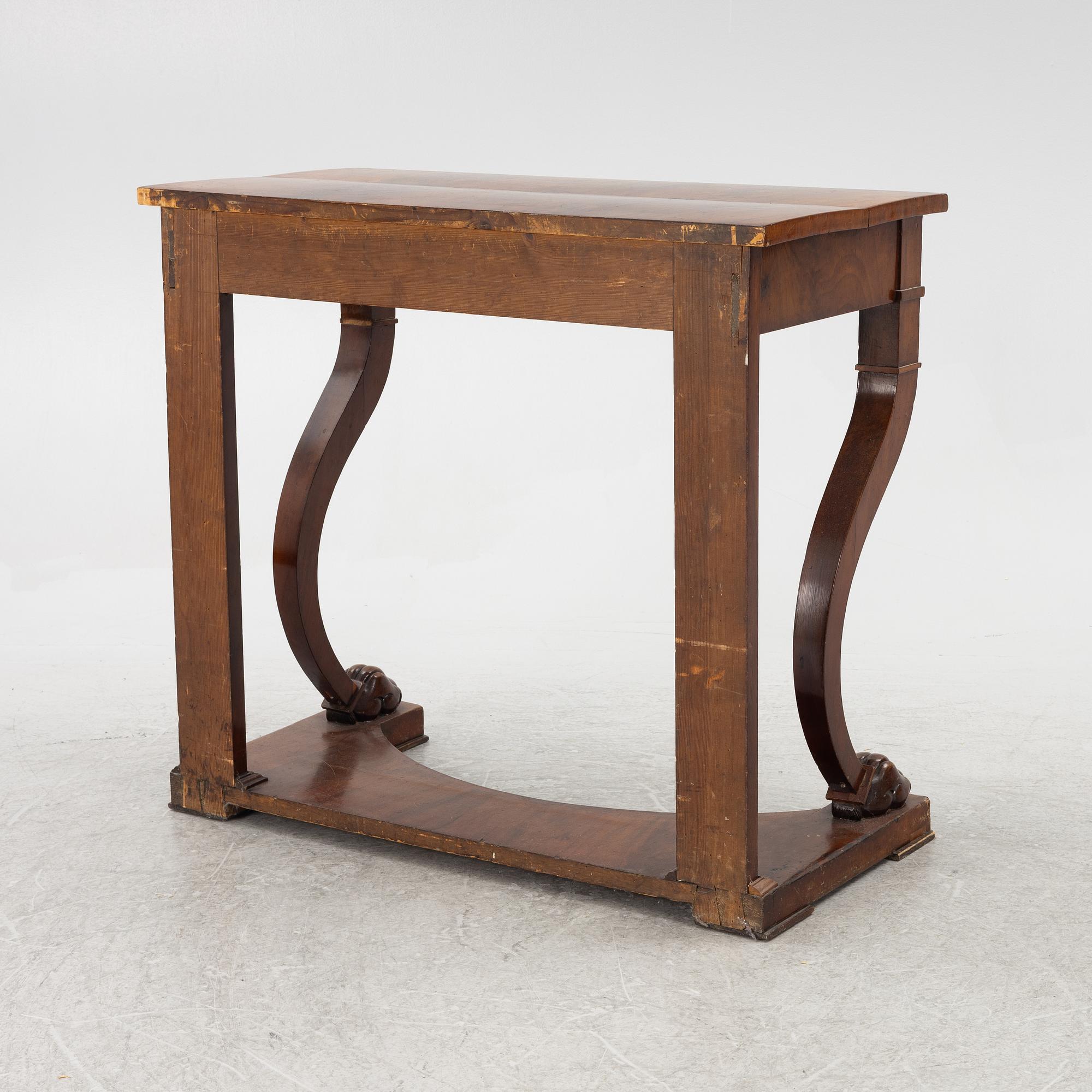 An empire console table, firts half of the 19th century.
