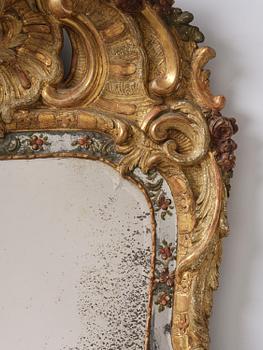 A Swedish giltwood and polychrome-painted Rococo mirror, later part of the 18th century.