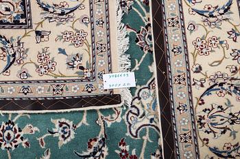 A Nain carpet, part silk, 6 laa, ca. 300 x 201 cm.