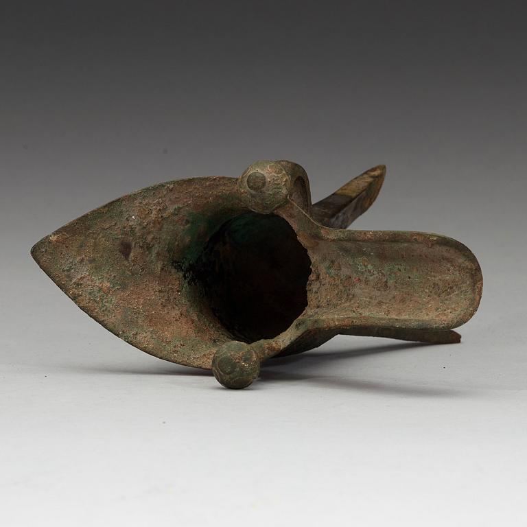 A bronze ritural tripod wine vessel 'Jue', presumably Shang dynasty, 12/11th Century BC.