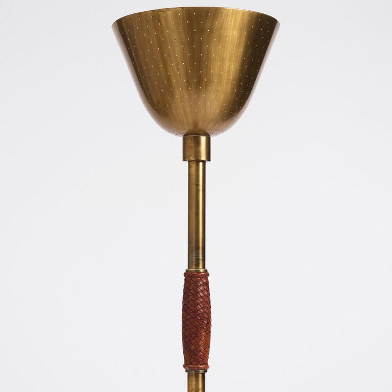 Carl-Axel Acking, a brass and leather floor lamp, designed for the Stockholm Association of Crafts in 1939.