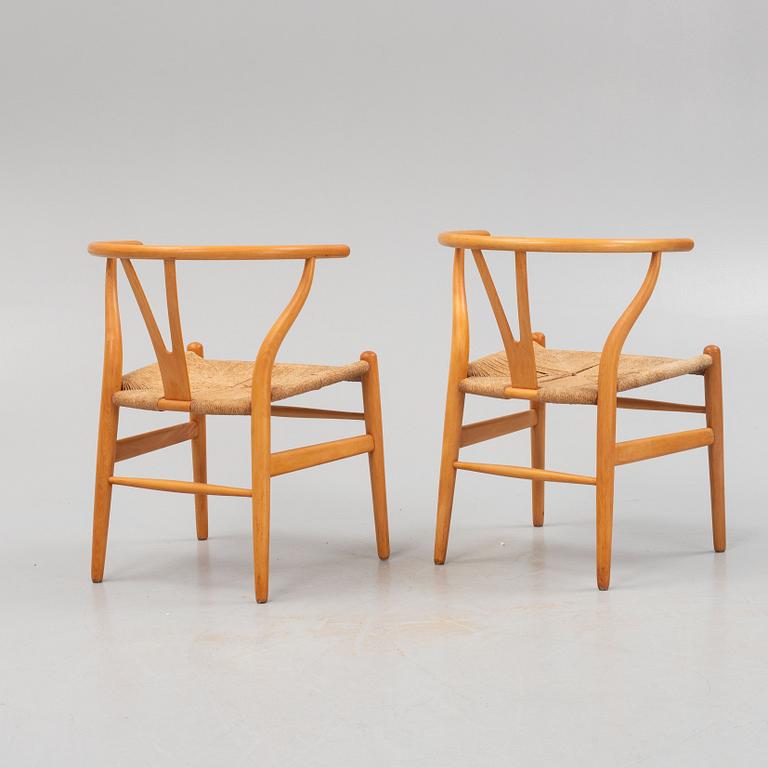 Hans J. Wegner, a pair of model CH-24 chairs, Carl Hansen &  Søn, Denmark.