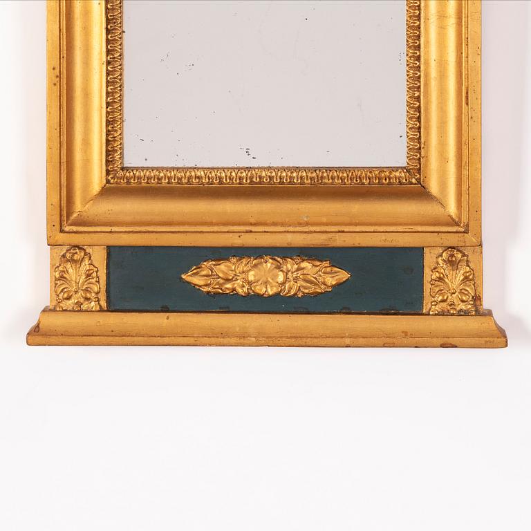 An Empire style mirror from around the year 1900.