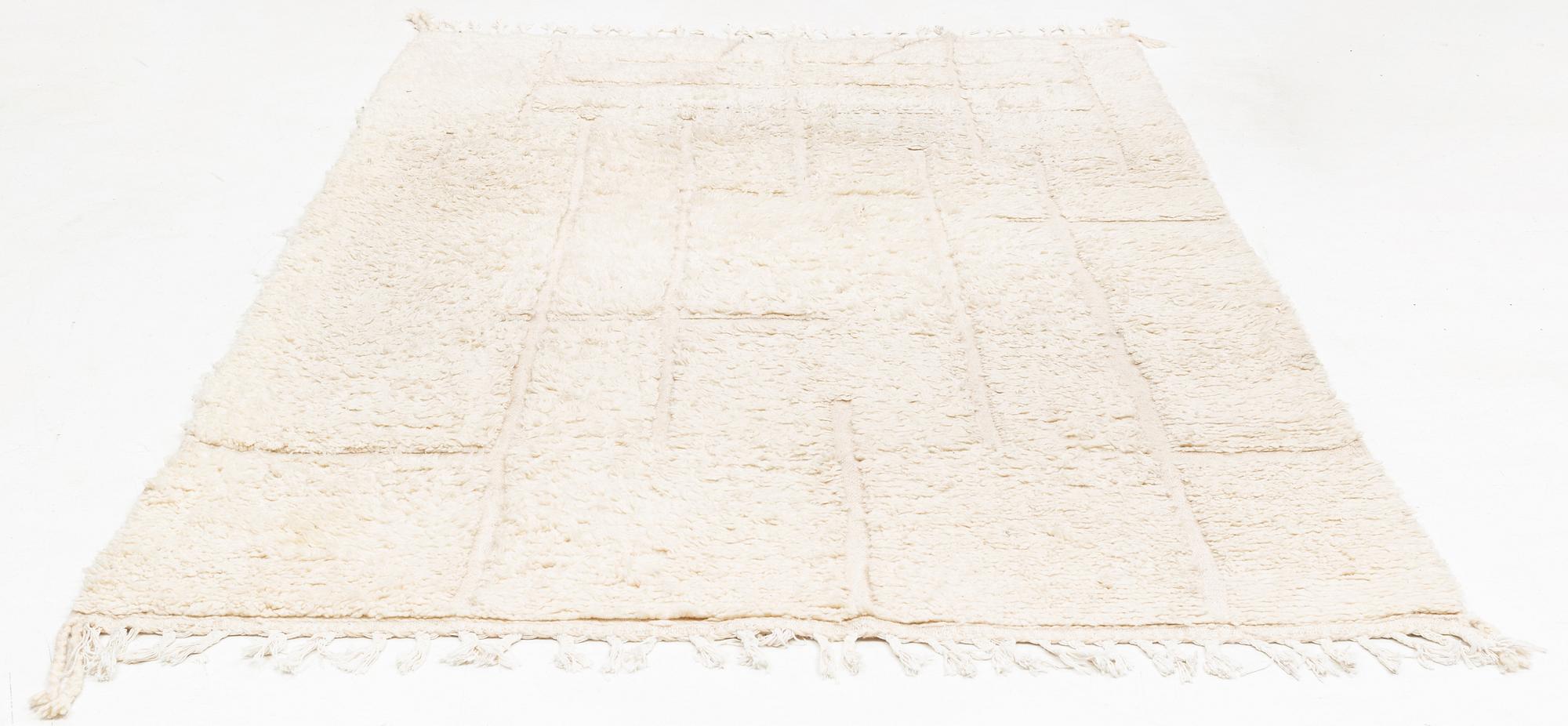 A Moroccan carpet, circa 308 x 181 cm.