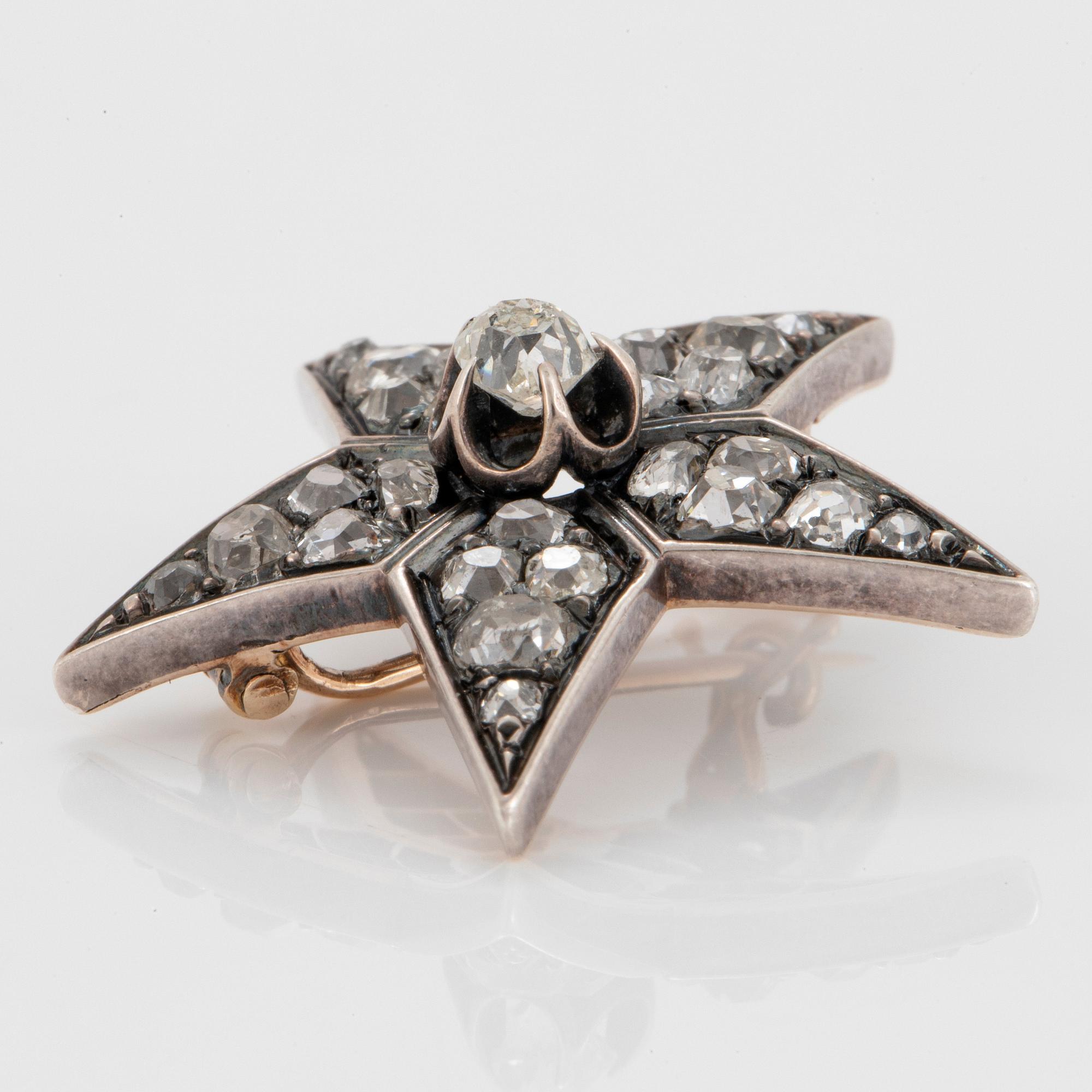 Brosch i form av stjärna silver och 14K guld med gammalslipade diamanter.