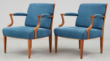 A pair of Josef Frank mahogany, ratten and blue fabric armchairs, Svenskt Tenn, model 969.