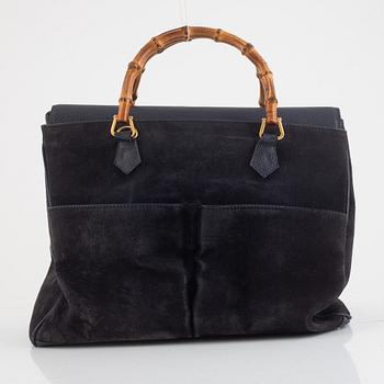 Gucci, a vintage bamboo and suede bag.