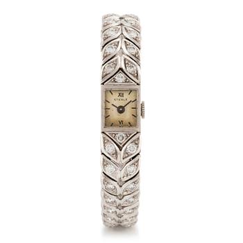 527. A Sterlé platinum wristwatch set with round brilliant-cut diamonds.