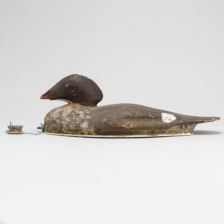 A early 20th century painted wood bird.