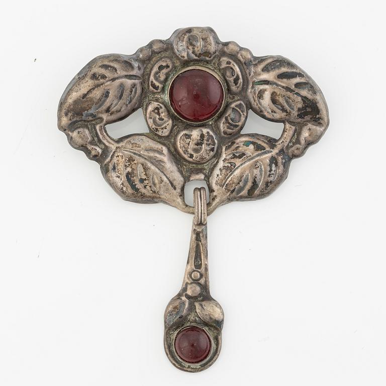 Brooch, Jugendstil, silver with red cabochon-cut stones.