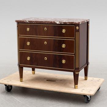 a 20th century gustavian style chest of drawer.