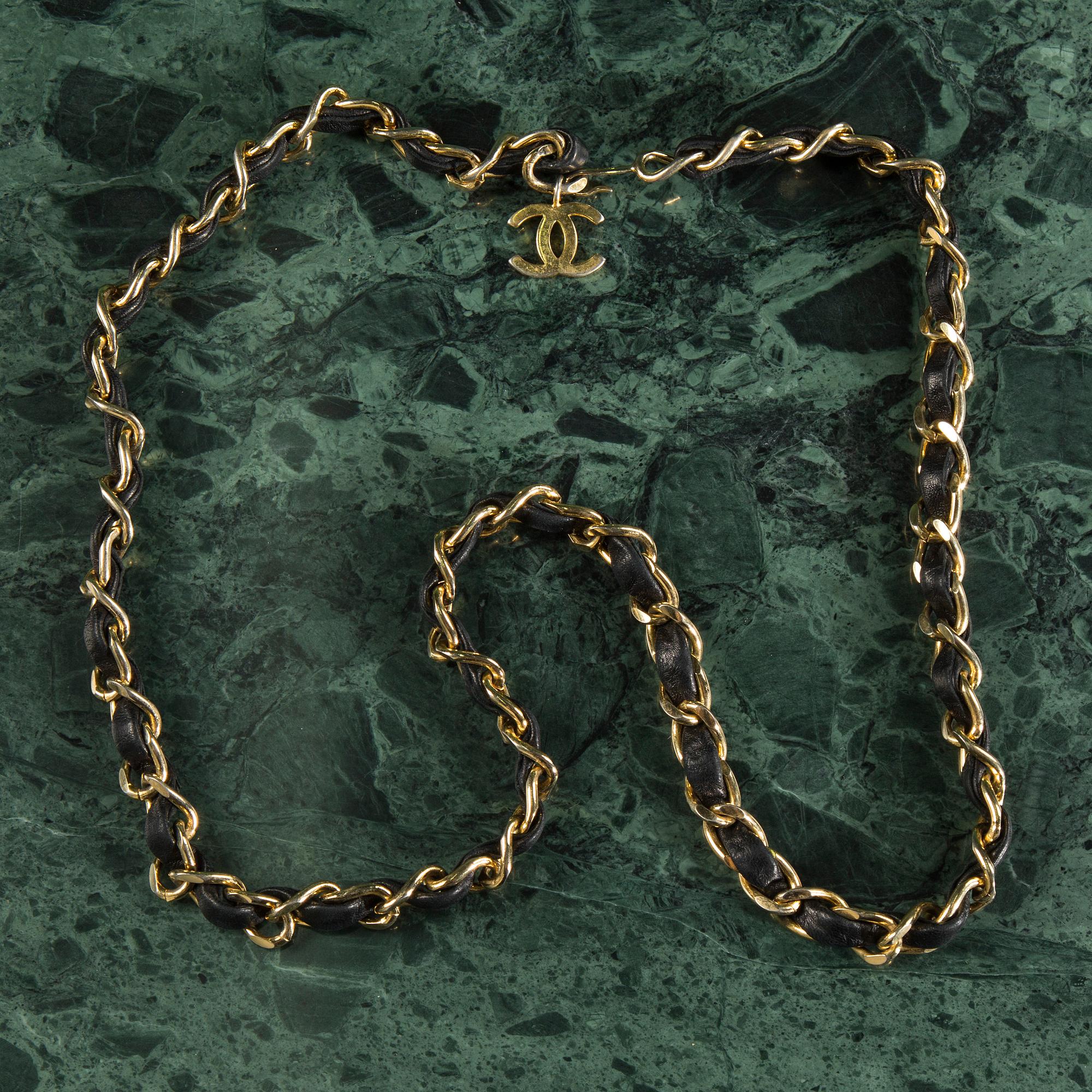 Belt with mini flap-bag by Chanel.