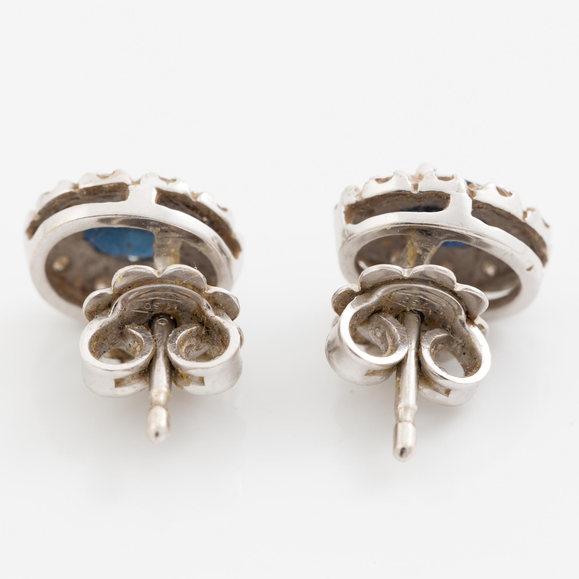 Earrings, a pair of 18K white gold set with dark sapphires and small brilliant-cut diamonds.