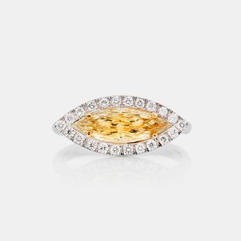 781. A 1.11 ct  yellow navette-cut diamond ring. Pavé-set brilliant-cut diamonds total carat weight circa 0.22 ct.