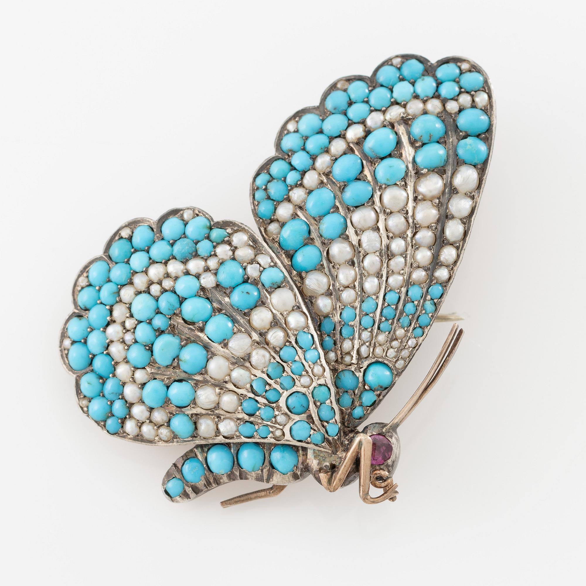 Brooch/pendant and earrings, in the form of butterflies, silver with turquoises and pearls.