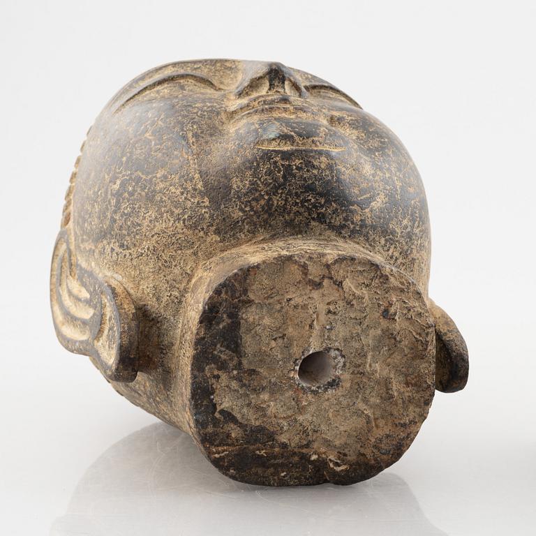 A Buddha's head, stone. Ming style.