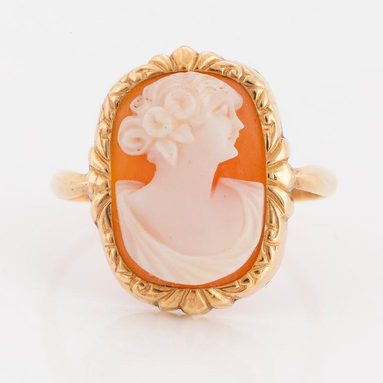 A ring with carved sea shell.