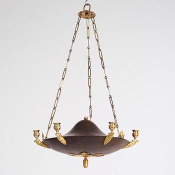 A Swedish Empire ormolu and tole six-branch chandelier, Stockholm, early 19th century.