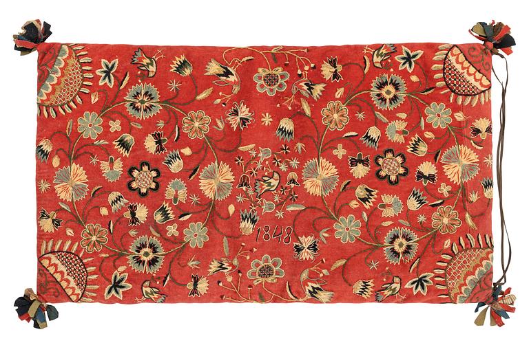 An embroidered carrige cushion, c. 92 x 52 cm, Scania, Sweden, dated 1848.