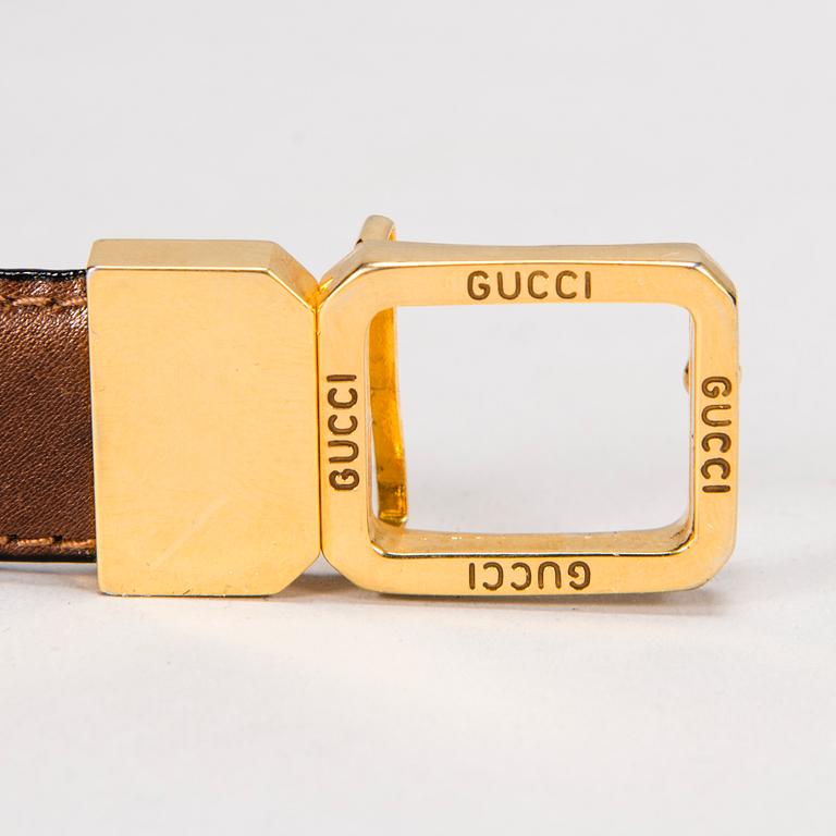 GUCCI Silk Blouse and a Leather Belt.