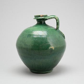 A green glazed ceramic bottle/jar, late Ming dynasty.